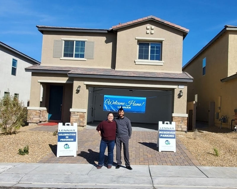 Couple Standing near the house